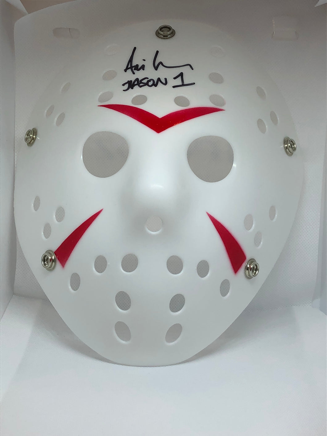 Jason Voorhees White Mask (without elastic band) from Friday the 13th  signed by Ari Lehman who played Jason (1) in the first Friday the 13th movie.